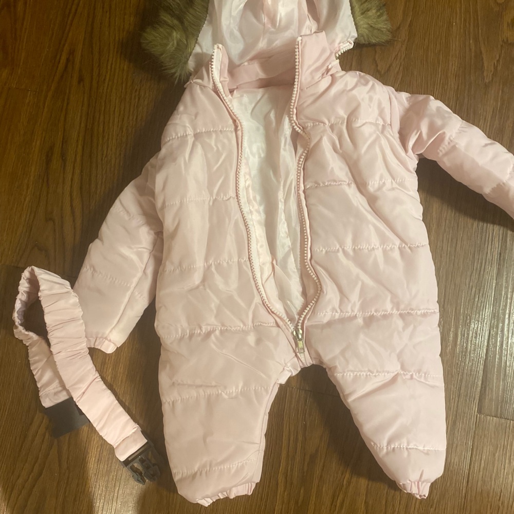 Baby pink snowsuit.